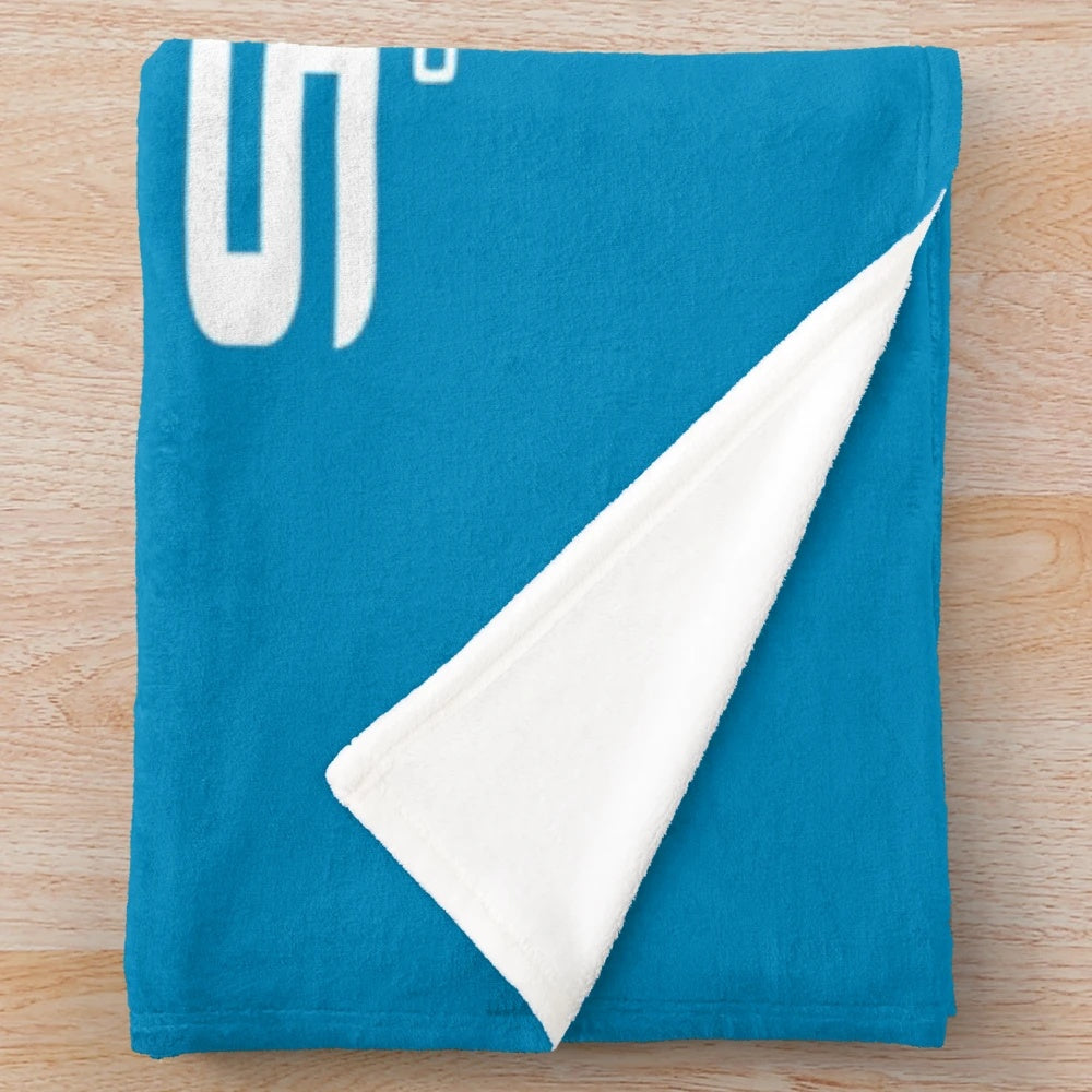 Cronulla Sutherland Sharks inspired plush blanket featuring a white shark design on a shield
