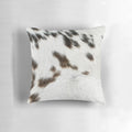 Cruelty-free cowhide pillow in tan, black, and white colors for natural, rustic farmhouse decor