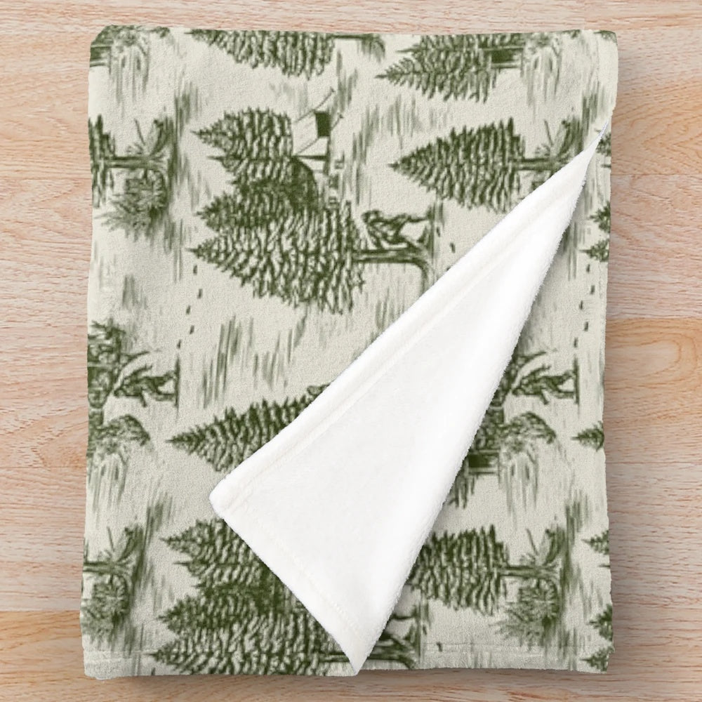 Bigfoot/Sasquatch inspired plush blanket featuring a forest green toile de jouy pattern