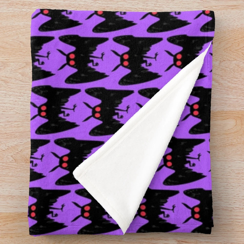 Cozy Mothman plush blanket with spooky cryptid design