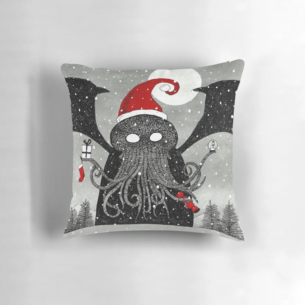A decorative pillow featuring a whimsical design of Cthulhu wearing a Santa hat against a snowy, moonlit backdrop
