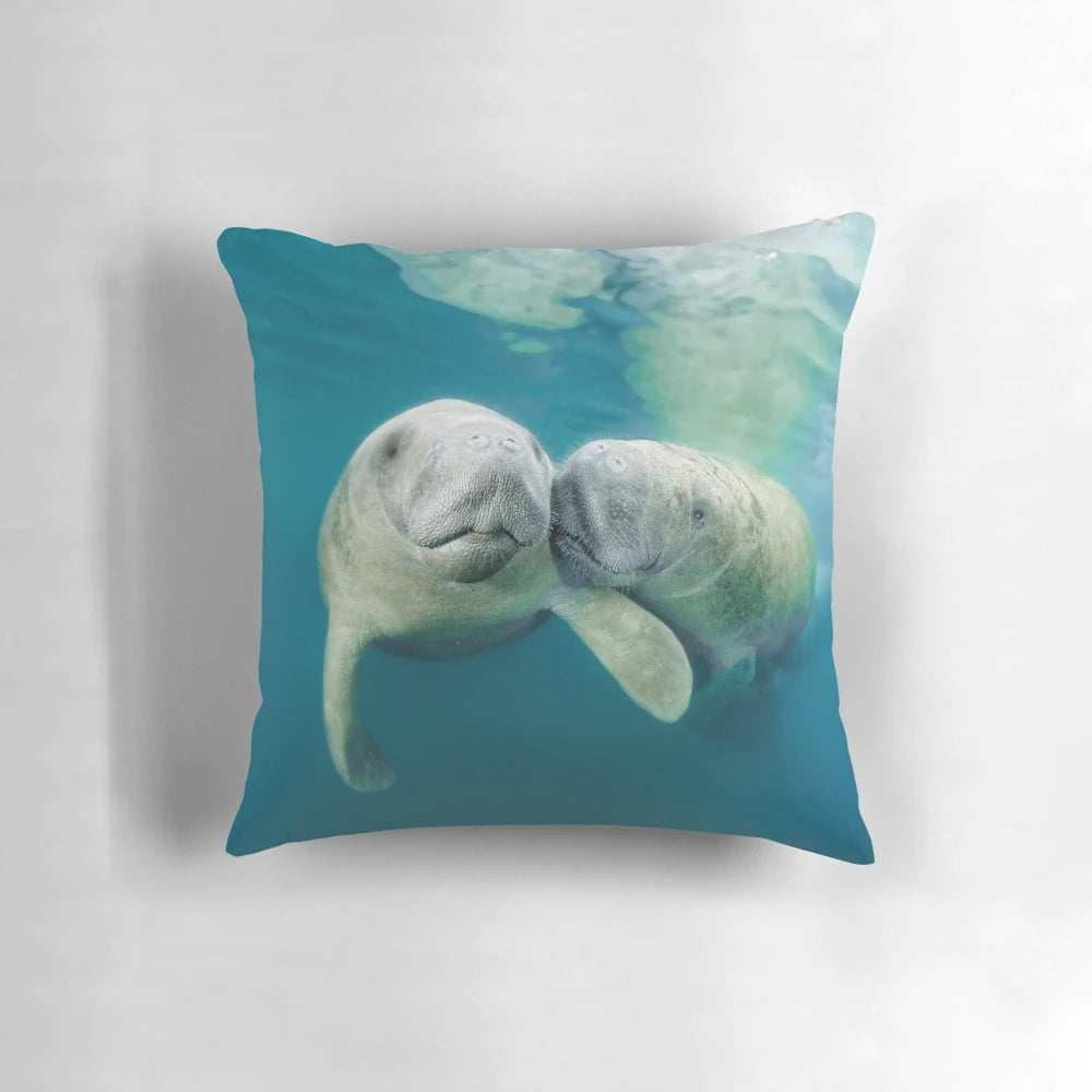 Lovers Pillow featuring a cute west indian manatee swimming underwater
