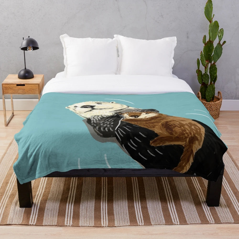 Soft and cozy plush blanket featuring an adorable Alaska sea otter mother and her baby