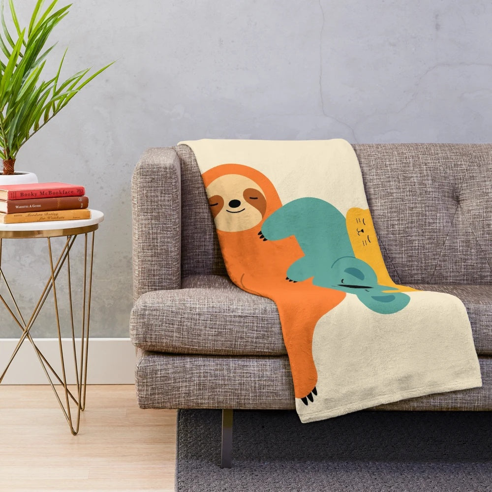 Cozy plush blanket with animal designs, perfect for relaxing and napping.
