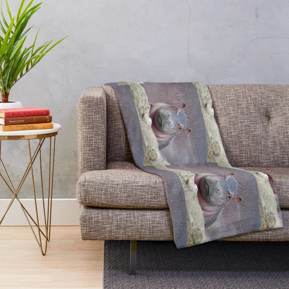 Soft and cozy plush blanket featuring the adorable baby hippo Fritz from the Cincinnati Zoo