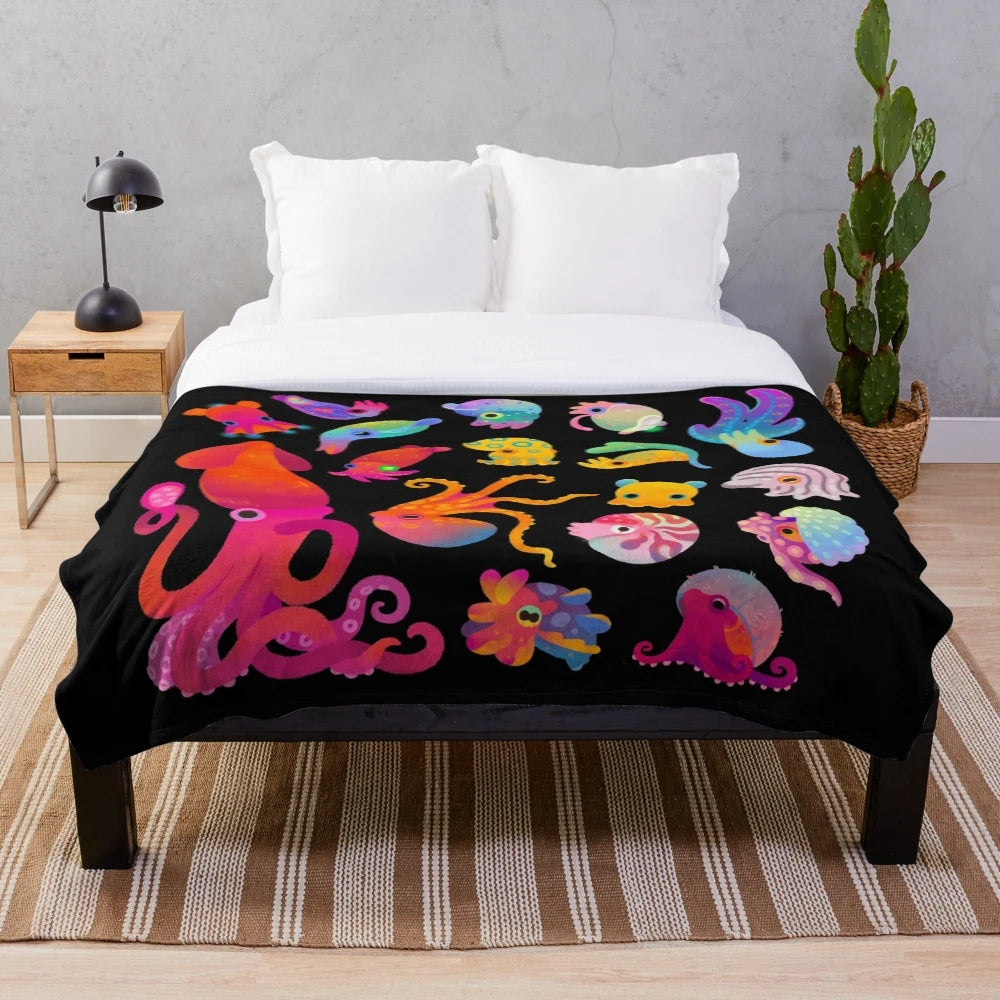 Plush cephalopod blanket featuring a cozy, soft design with ocean animal details
