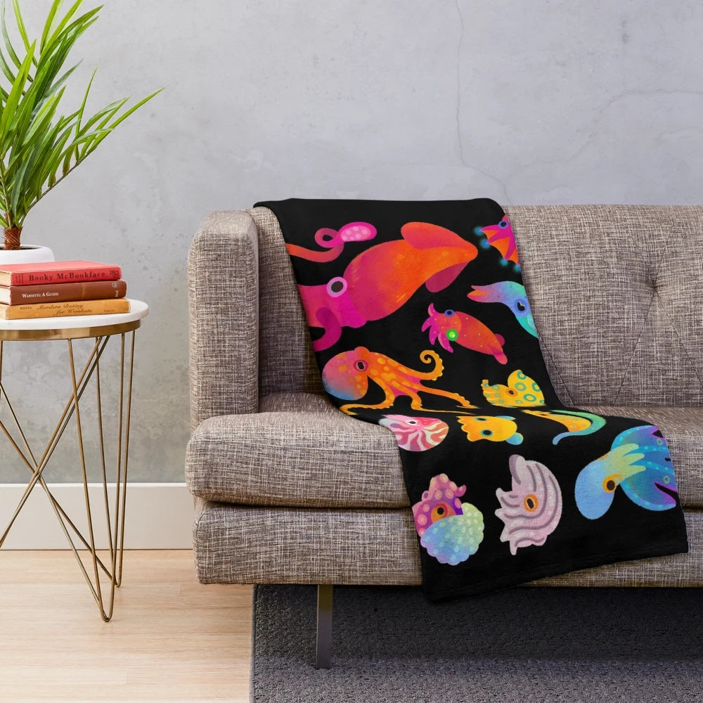 Plush cephalopod blanket featuring a cozy, soft design with ocean animal details