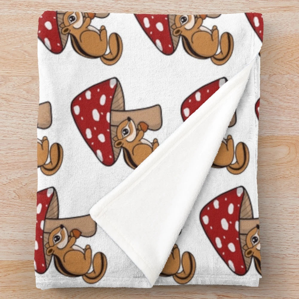 Soft and snuggly chipmunk plush blanket with forest and mushroom design
