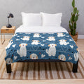 Soft and fluffy cream and white goldendoodle plush blanket