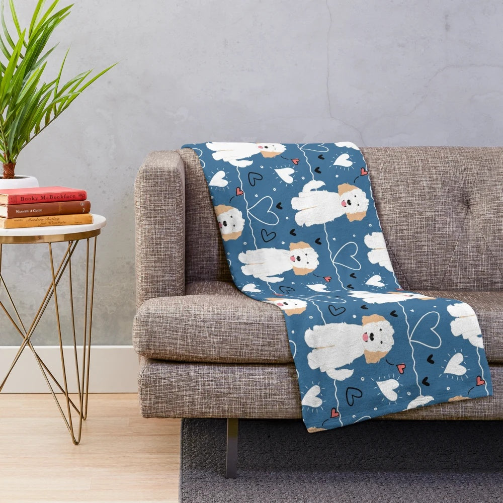 Soft and fluffy cream and white goldendoodle plush blanket