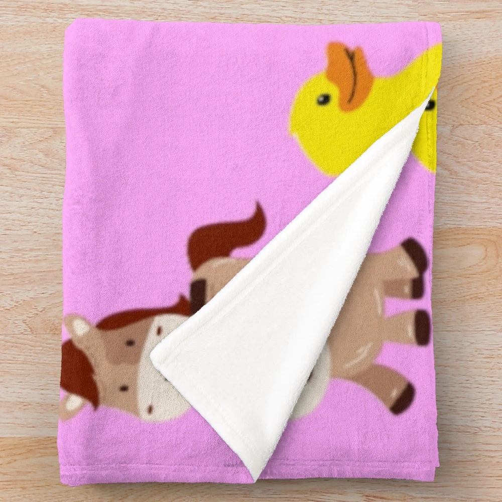 Soft, plush blanket featuring a cute animal design