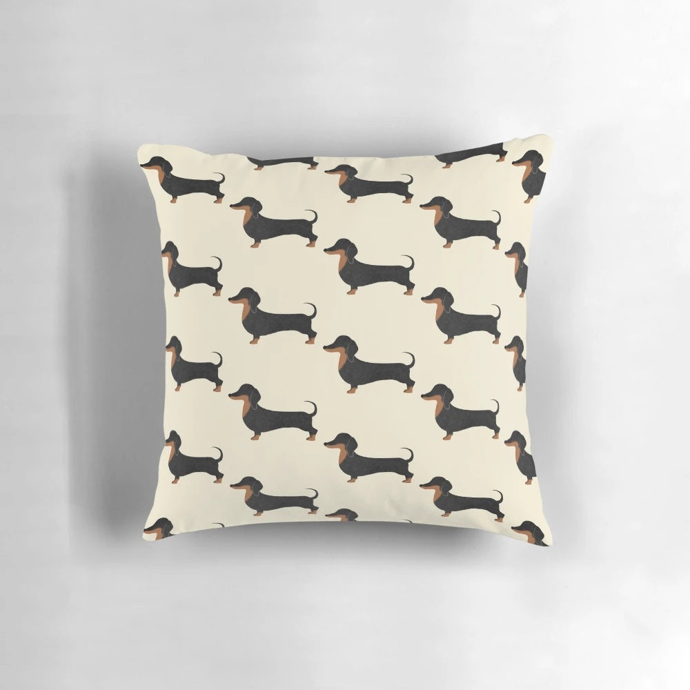 A soft, black dachshund pillow with a cute, playful design that makes the perfect home accent.