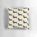 A soft, black dachshund pillow with a cute, playful design that makes the perfect home accent.
