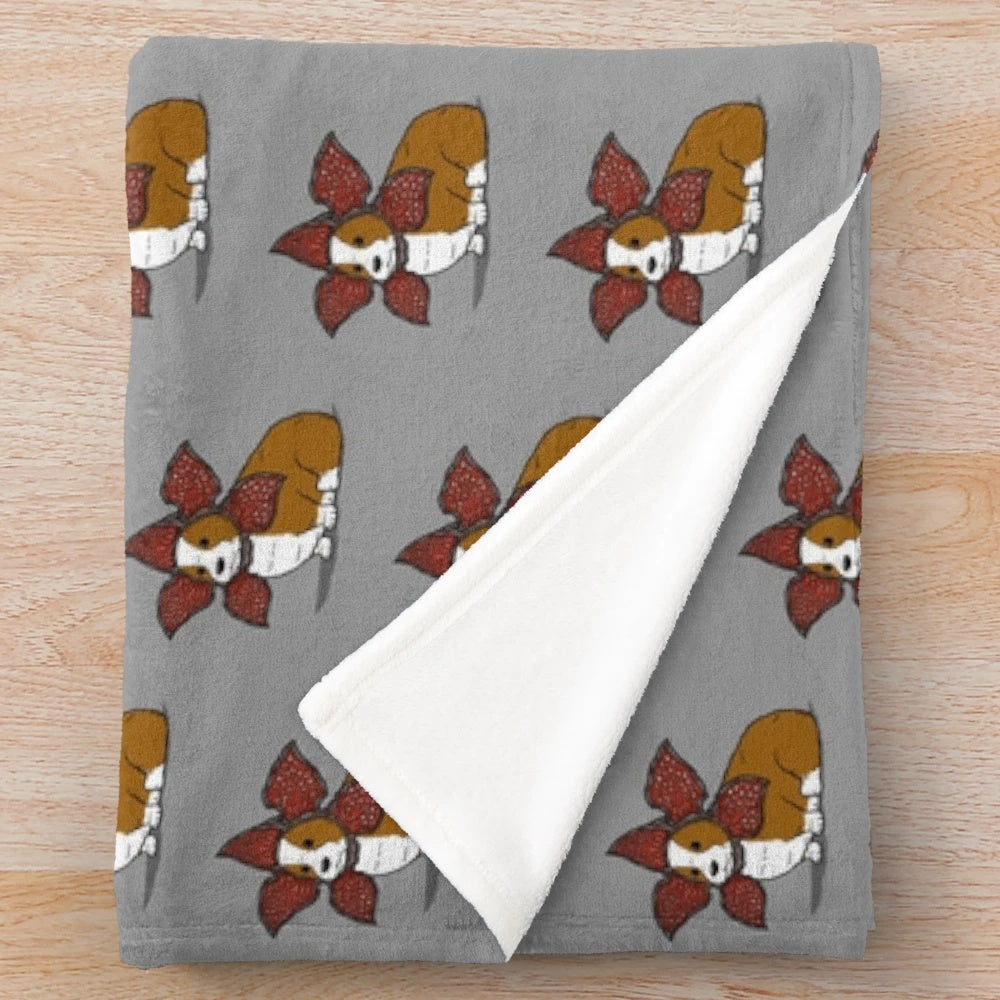 Democorgi inspired plush blanket featuring a cute corgi dog in a monster costume