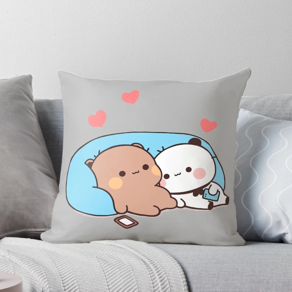 A plush pillow featuring the cartoon characters Dudu Bear and Bubu Panda, snuggling together under red hearts.