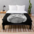 Soft, cuddly hippopotamus plush blanket with a whimsical drawing of a hippo