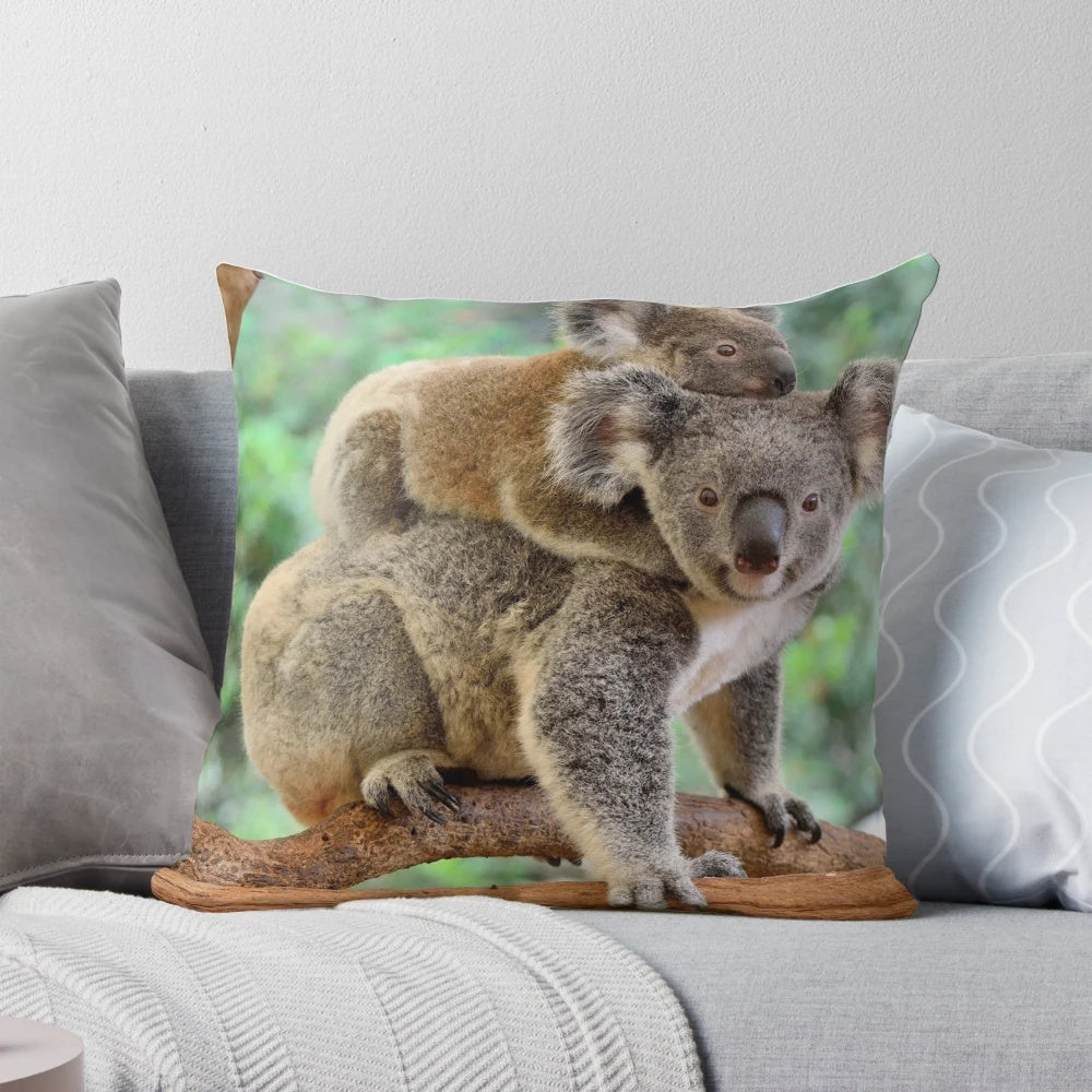 Soft and plush pillow featuring a mother koala and her baby joey relaxing in a tree