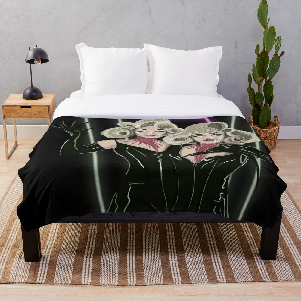 Cozy plush blanket featuring the Boulet Brothers' iconic Dragula monsters