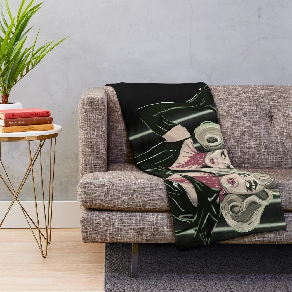 Cozy plush blanket featuring the Boulet Brothers' iconic Dragula monsters