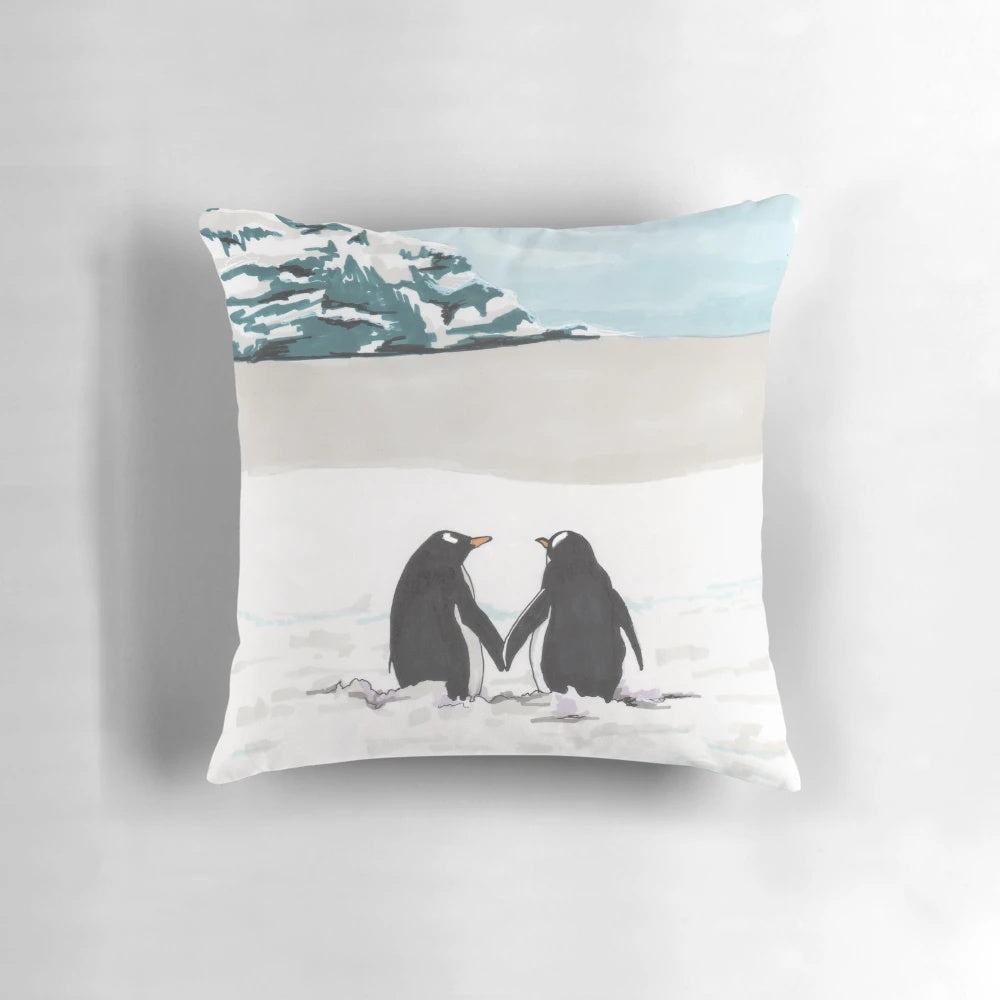 Soft and plush pillow featuring a loving couple of penguins in a snowy, arctic scene