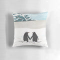 Soft and plush pillow featuring a loving couple of penguins in a snowy, arctic scene