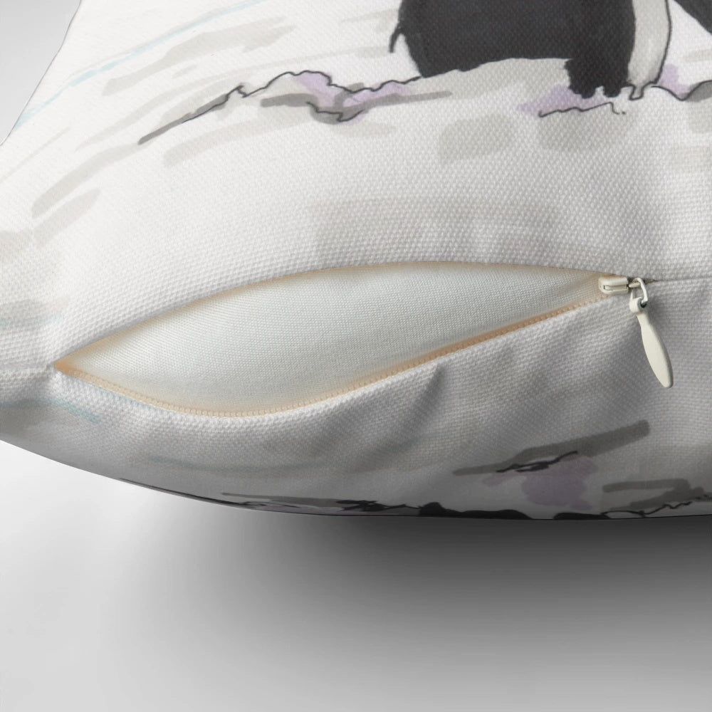 Soft and plush pillow featuring a loving couple of penguins in a snowy, arctic scene