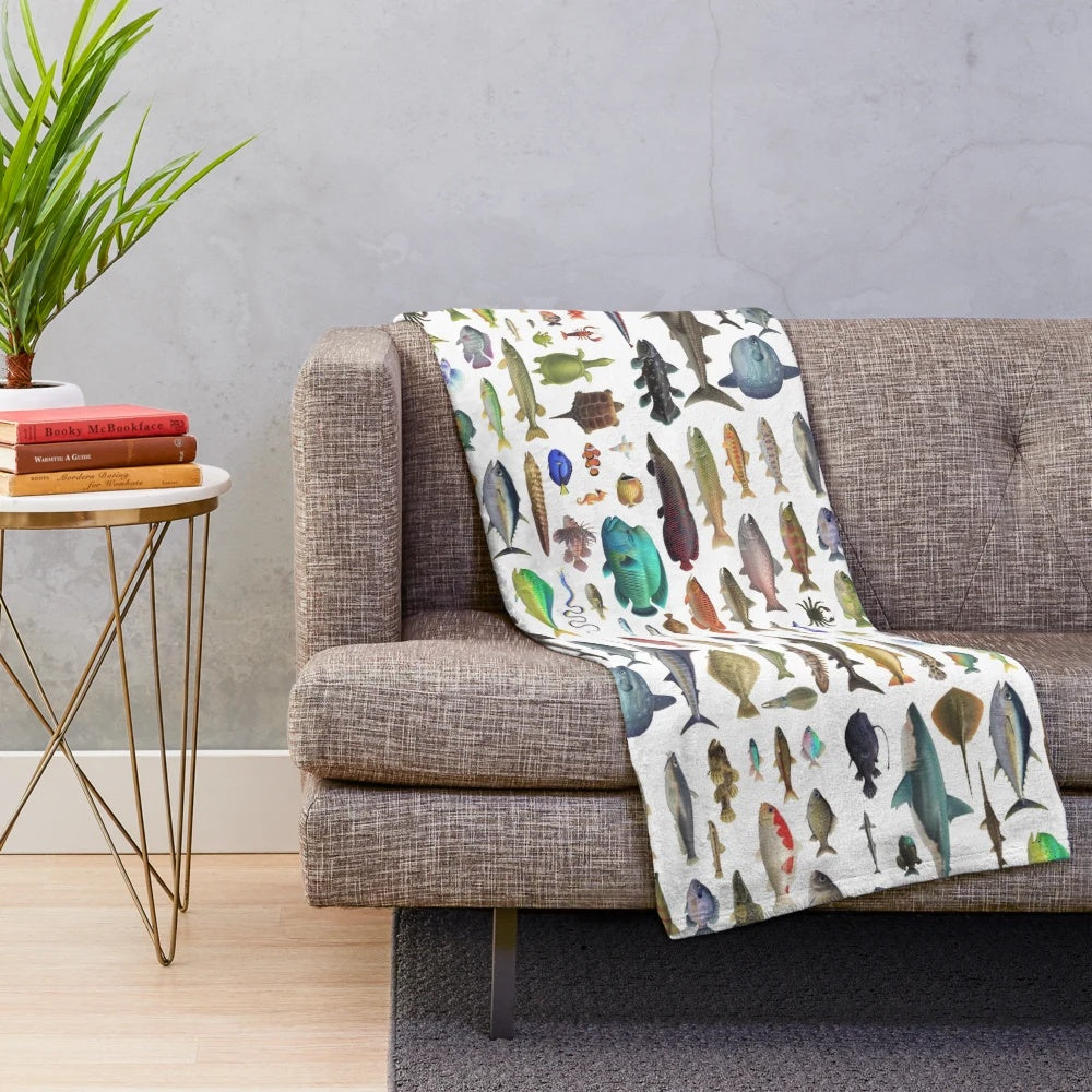 Plush blanket with various fish, sea creatures, and Animal Crossing critters