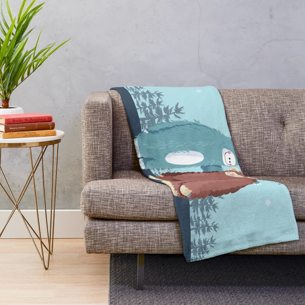 Soft and cozy plush blanket featuring a bigfoot or sasquatch design