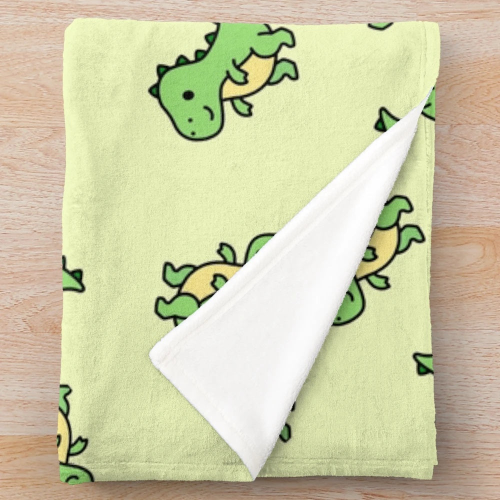 Cuddly T. Rex plush blanket with a green and teal color scheme