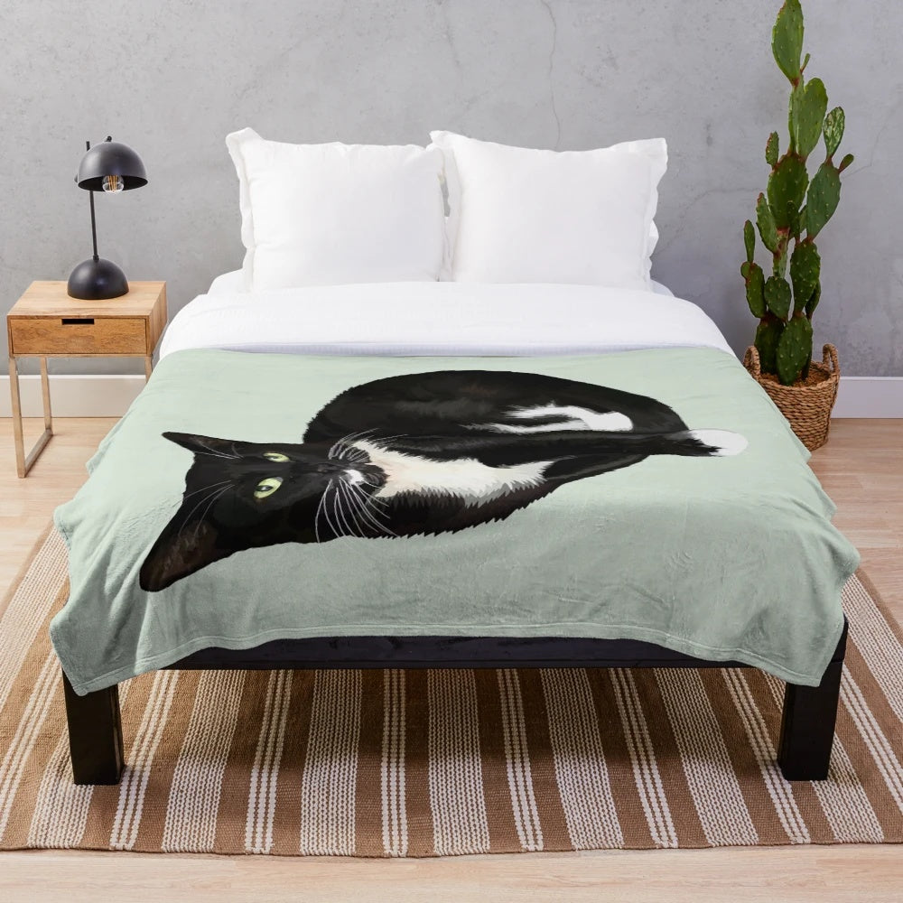 Soft and cozy plush blanket with a tuxedo cat portrait