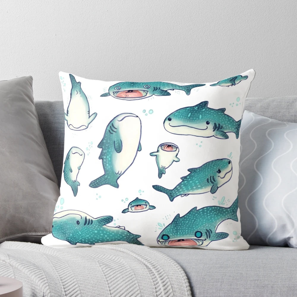 A soft, plush whale shark pillow in a blue and white color scheme, perfect for adding a touch of marine life to any space.
