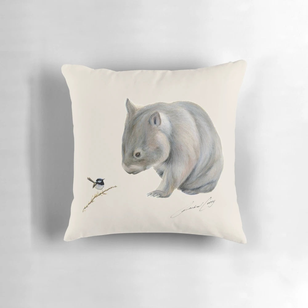 A plush pillow featuring an illustration of a wombat and a blue fairy wren, an iconic Australian wildlife duo.