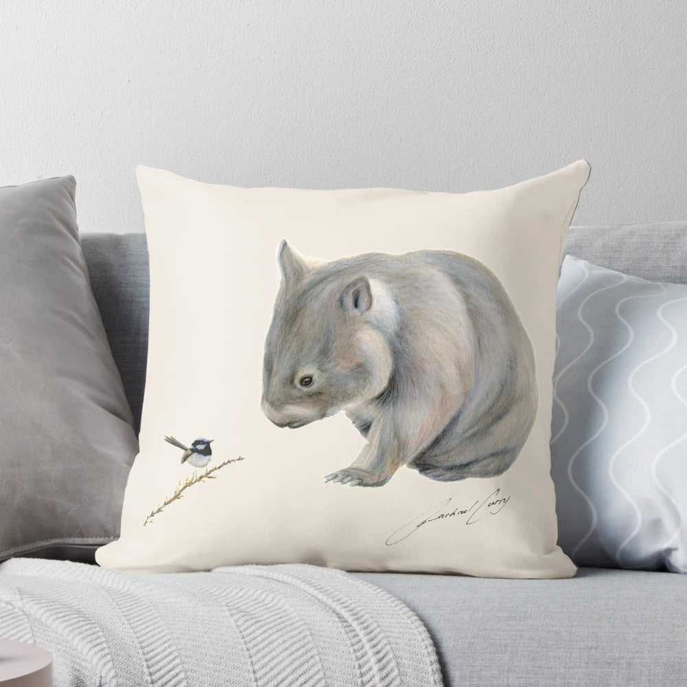 A plush pillow featuring an illustration of a wombat and a blue fairy wren, an iconic Australian wildlife duo.