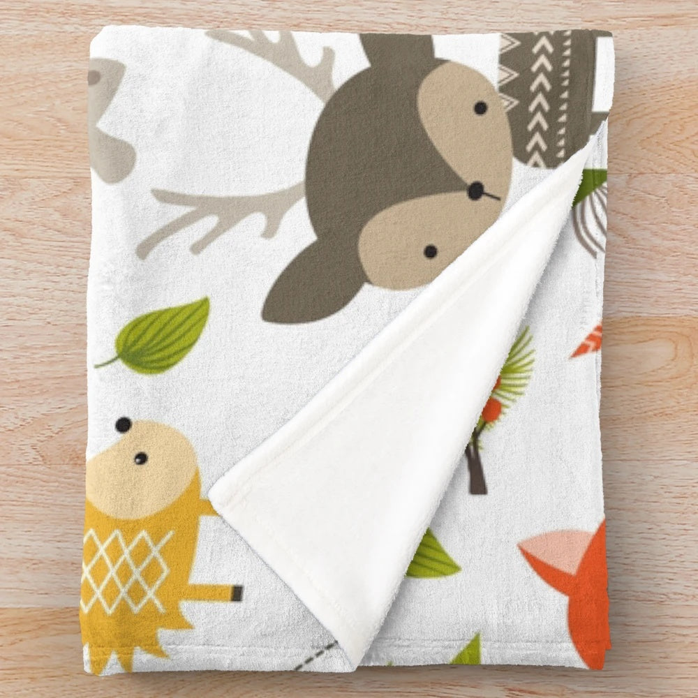 Woodland animals plush blanket with raccoons, deer, foxes, and owls