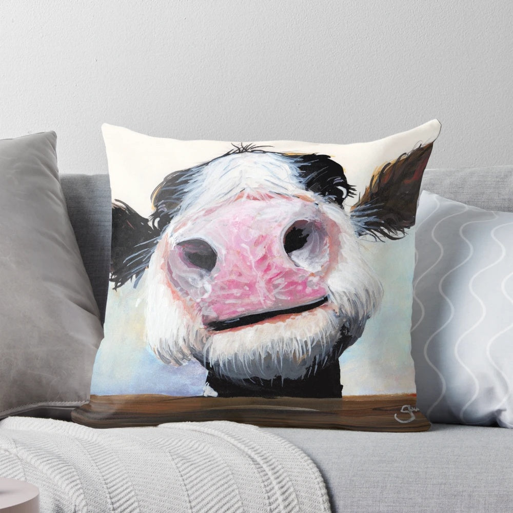 Whimsical cow pillow with a curious, cheeky expression