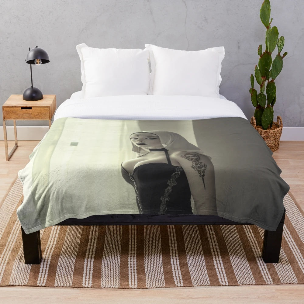 Cursed plush blanket featuring a dark, demonic nun design