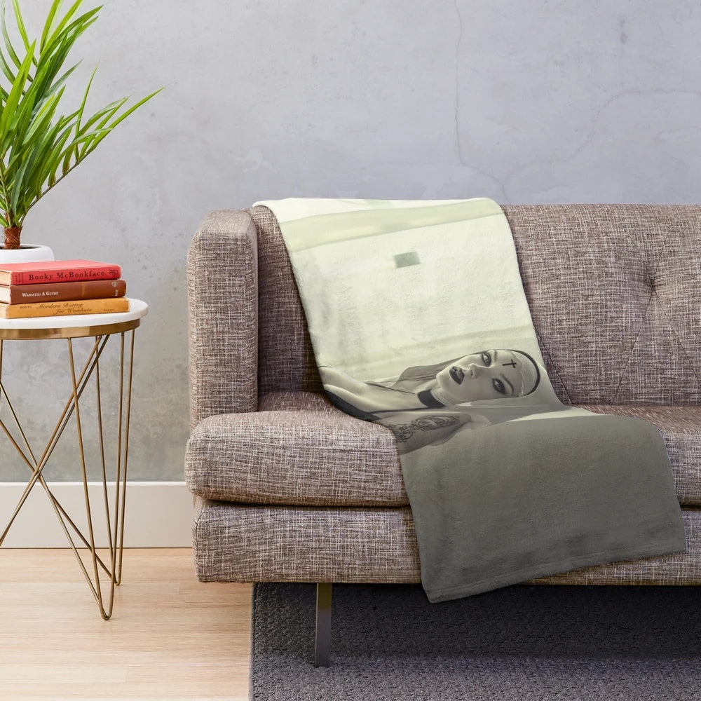 Cursed plush blanket featuring a dark, demonic nun design