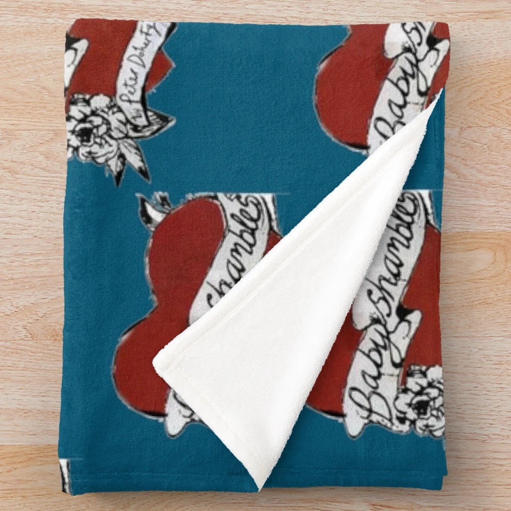 Plush blanket with indie rock band-inspired heart tattoo design