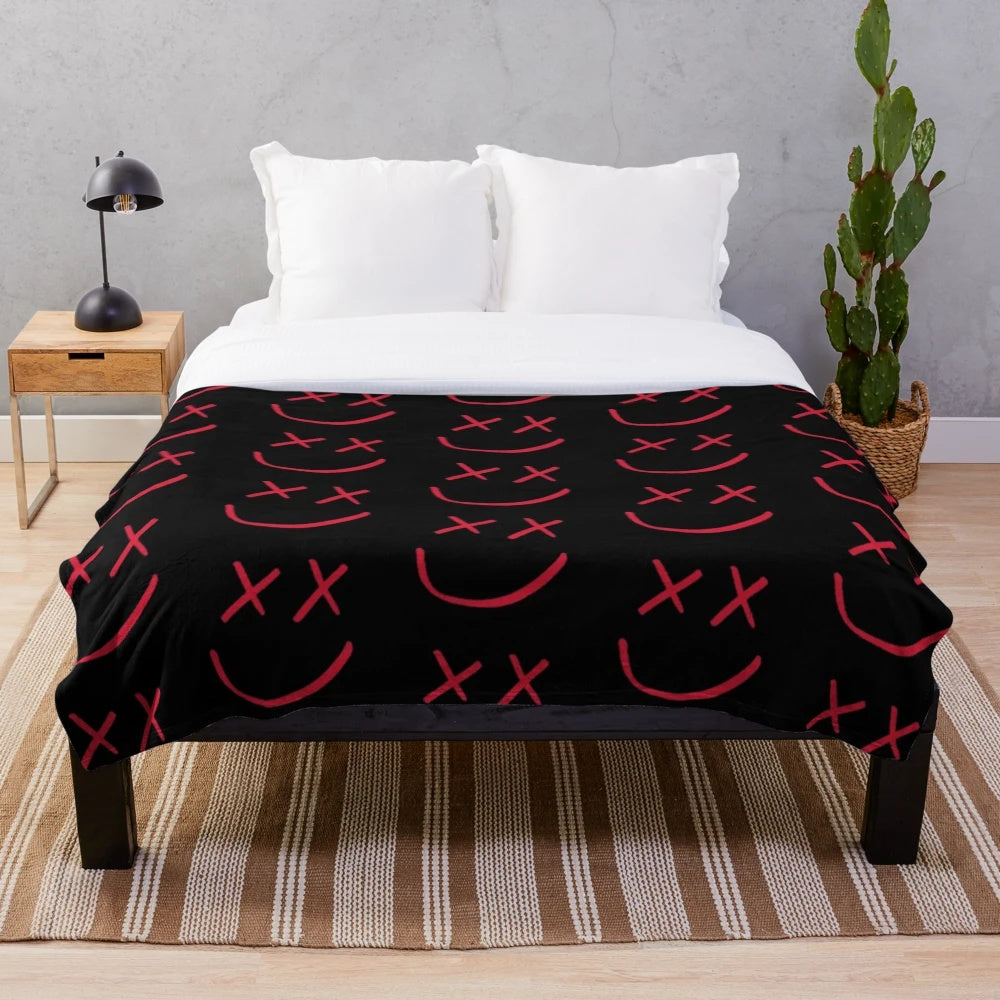 Red plush blanket with Louis Tomlinson's smiley logo