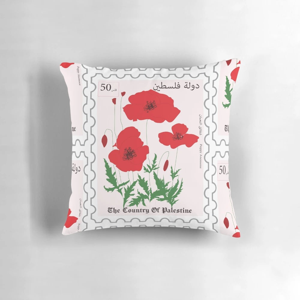 Vibrant poppy flowers in Palestinian postage design on a pillow