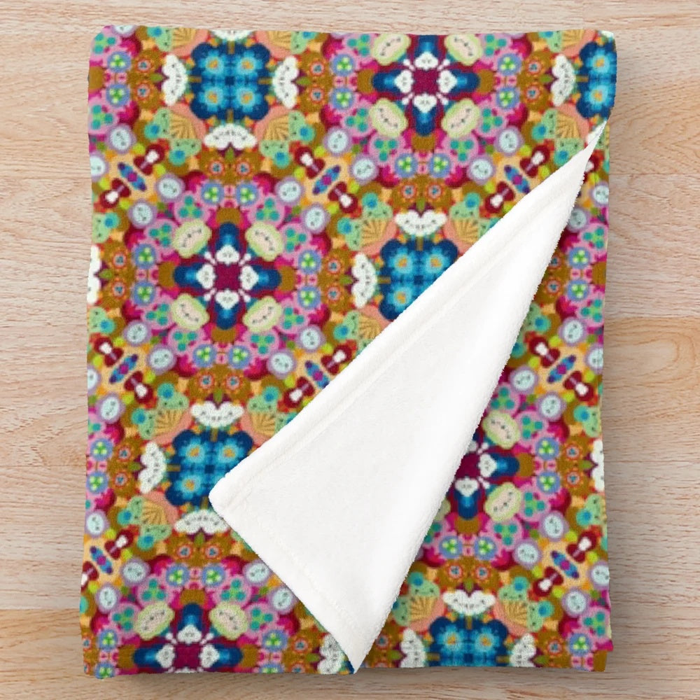 Patterned plush blanket with a variety of designs