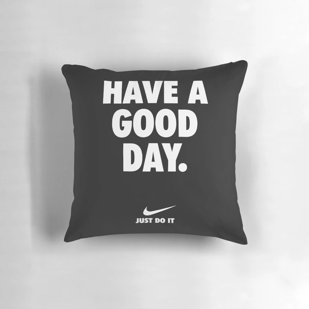 Black pillow with a motivational phrase in Nike-inspired typography