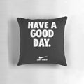 Black pillow with a motivational phrase in Nike-inspired typography