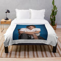 Plush blanket with a custom Trevor Zegras hockey player design