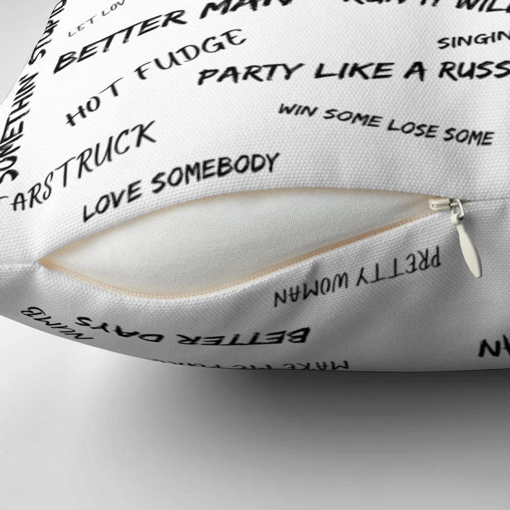 Pillow with Robbie Williams song titles printed on it