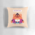 A soft, plush pillow featuring a charming, cuddly bear character.