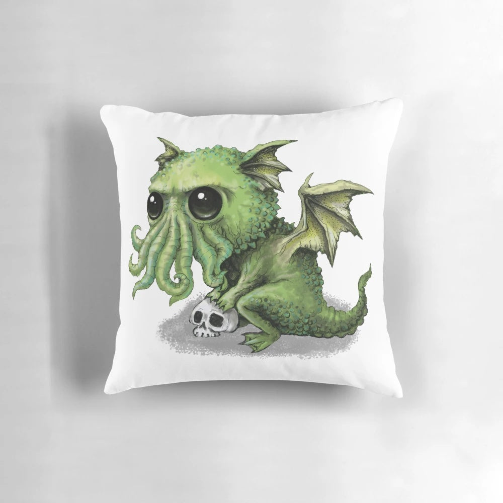 Cozy Cthulhu dragon plush pillow featuring a cute, ghoulish cosmic horror design