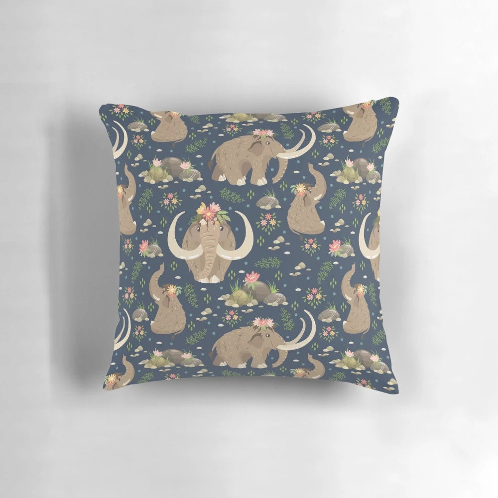 A cozy blue and white throw pillow featuring an adorable extinct mammoth design with a nature-inspired ethnic floral pattern.