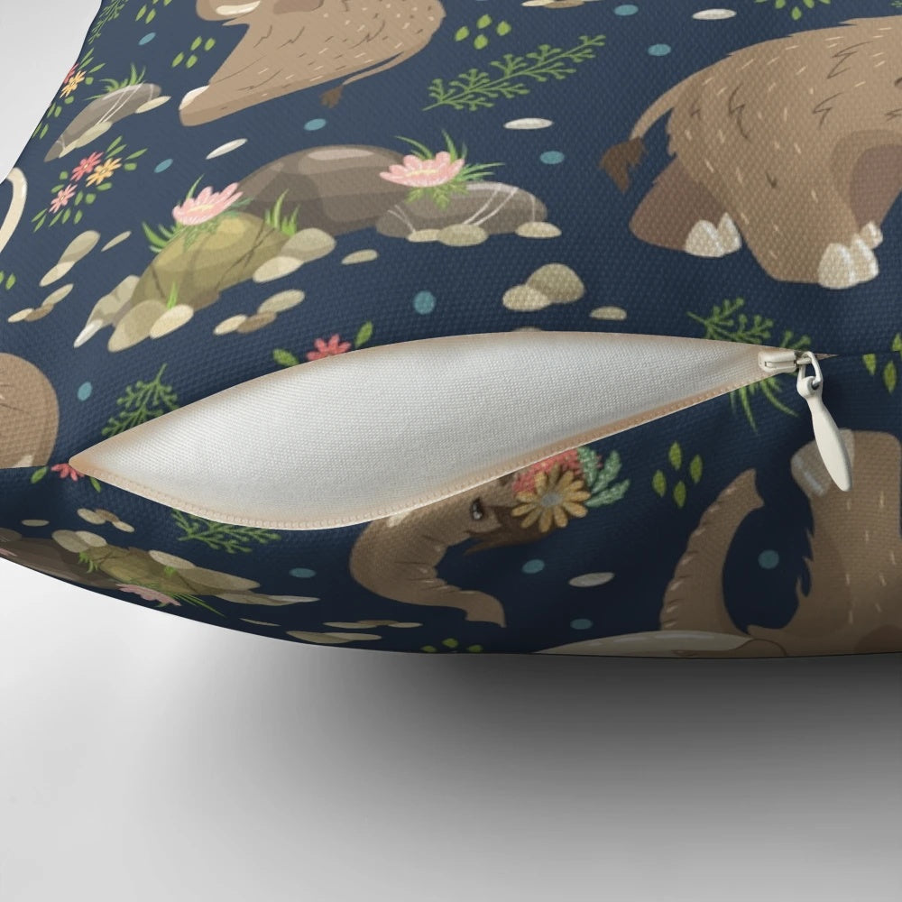 A cozy blue and white throw pillow featuring an adorable extinct mammoth design with a nature-inspired ethnic floral pattern.
