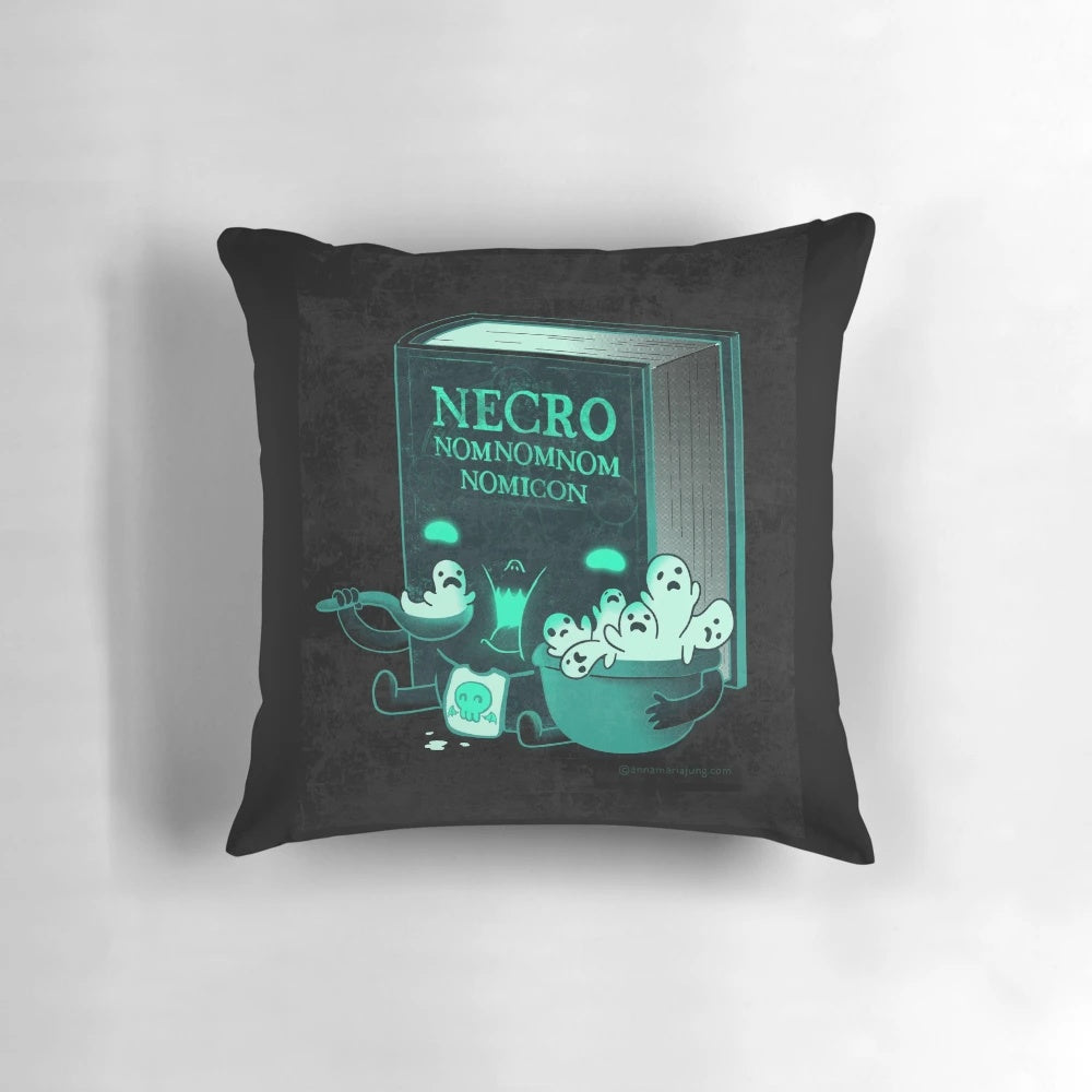 Adorable Necronomicon-themed pillow with a whimsical "nomnomnom" design, perfect for Lovecraft and Cthulhu fans.
